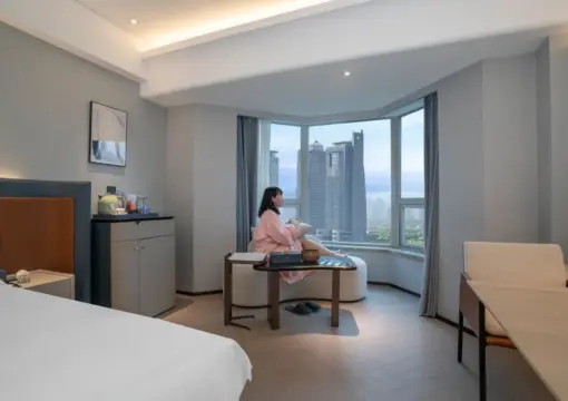 Big Bed Room With Night View On The Bund
